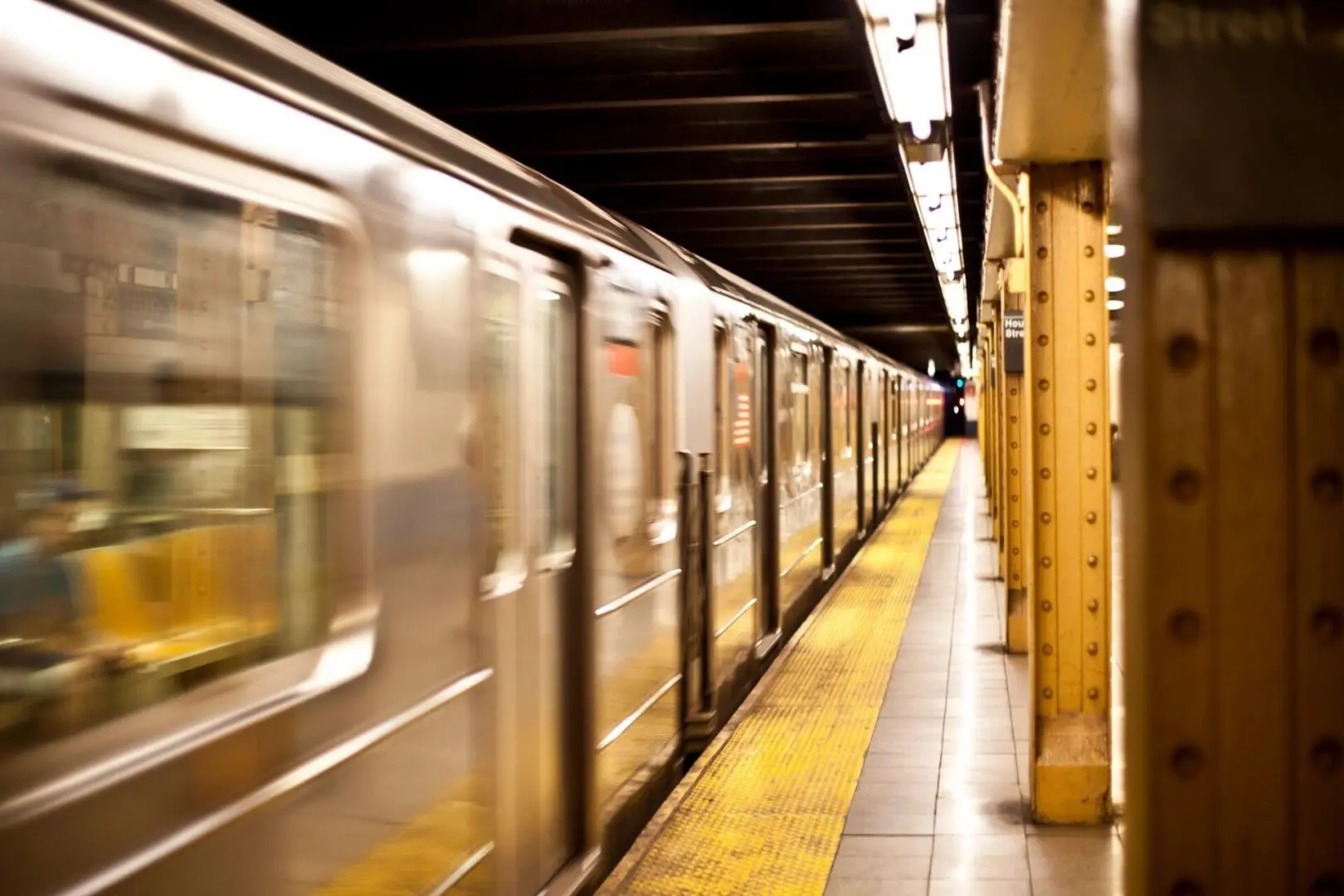 A subway train is going down the tracks.