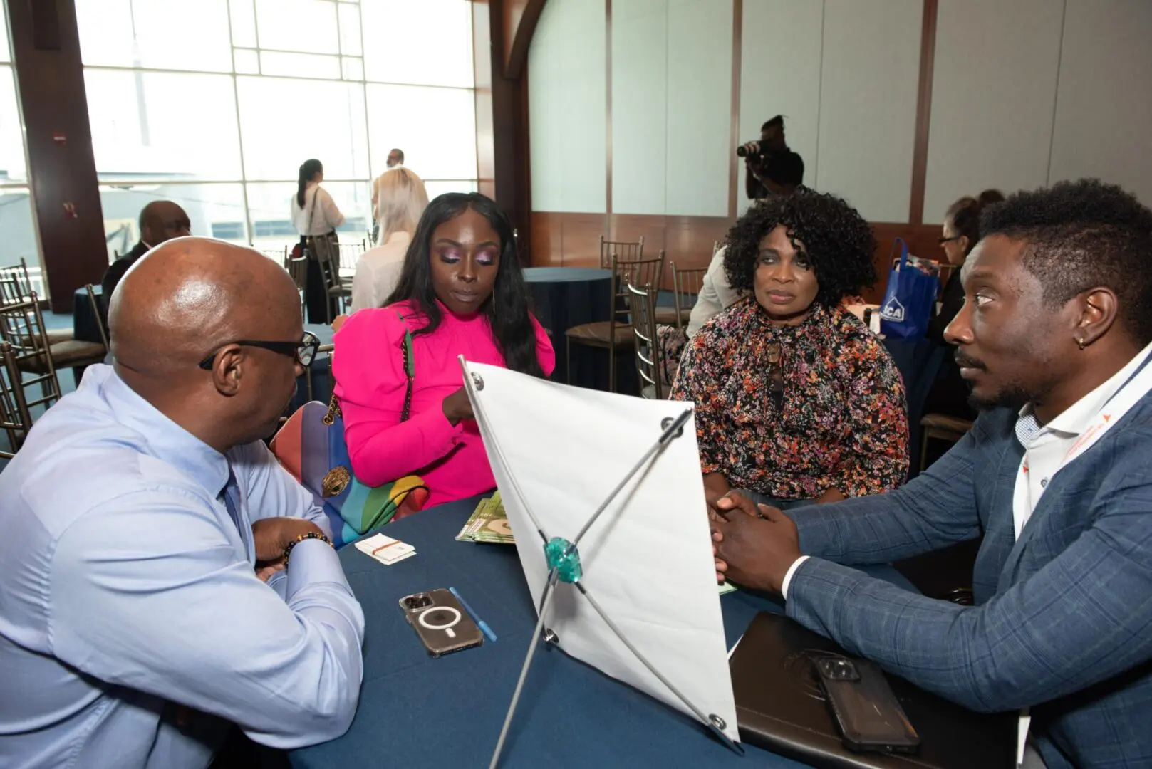 A group of people sitting around a table.